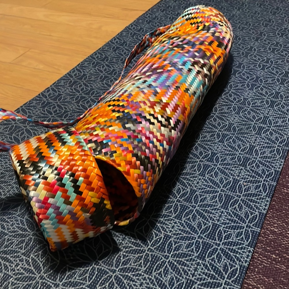 Yoga mat carrier with strap